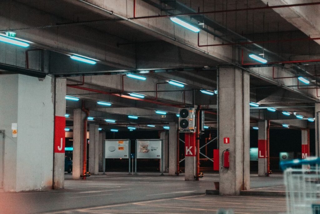 Indoor parking garage with concrete ceiling slab and pillars
